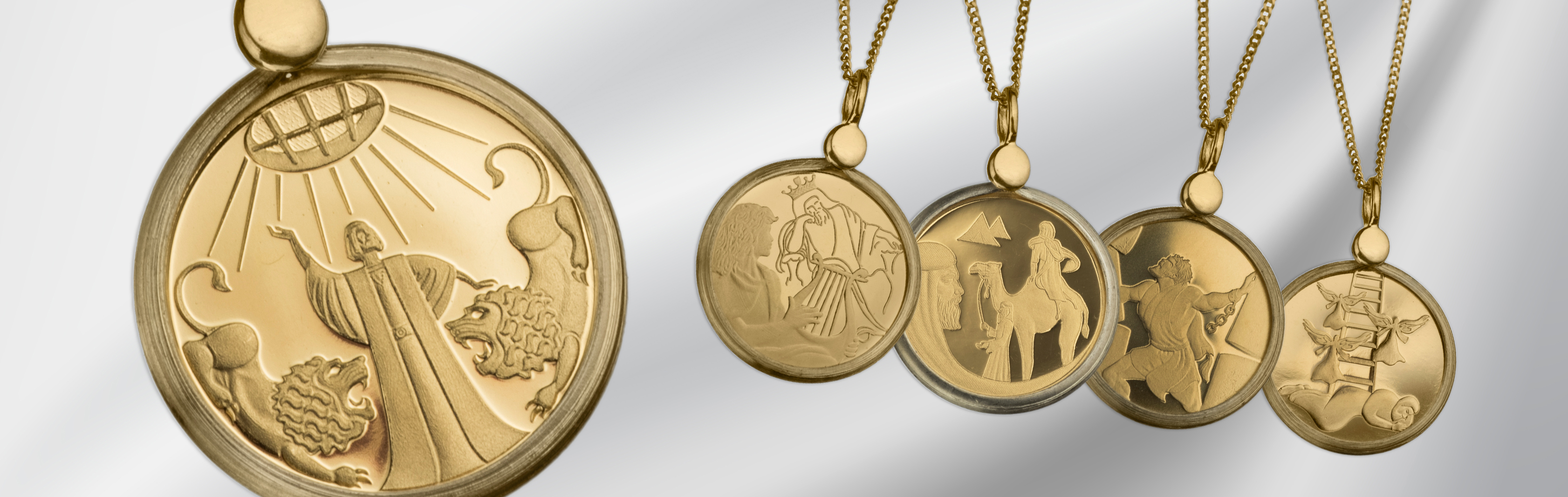 A 14k Gold Jewelry collection mounted with coins issued by the Bank of Israel. This collection presents an array of beloved collection coins including the ‘Wolf with the Lamb,’ ‘Parting of the Red Sea’, ‘Jonah in the Whale,’ and others from the Biblical A