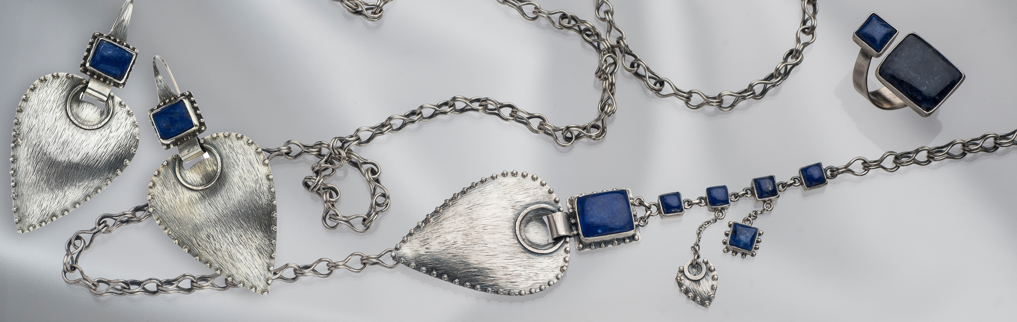 Silver jewelry, impressive silver jewelry, silver and gems, long silver necklace, silver necklace with presence, wide silver ring, silver ring for man, limited edition jewelry, lapis lazuli, sodalite, gemstone, natural gems, wrap ring, GRAS Handmade limit